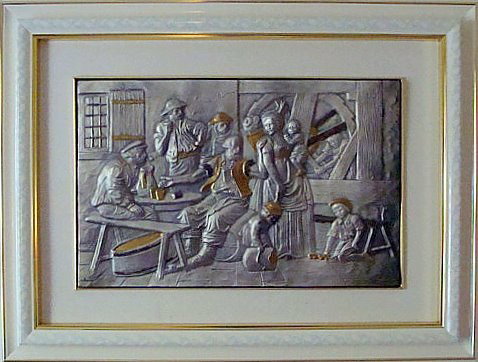 EMBOSSED STERLING SILVER RELIEF WALL PLAQUE: Embossed sterling silver relief wall plaque with gold colored accents. Depicts people and children inside at a table. Stamped "925" and signed "Capitavelli" lower left corner. Mounted and framed in wh