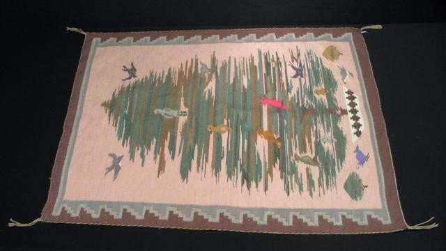 INDIAN HAND WOVEN WOOL TAPESTRY BLANKET: Hand woven Indian tapestry blanket. Depicts a tree with birds. Colors of pink, brown, green, red, white, and more. Measures 35" tall x 27" wide. Condition: some minor discoloration, fraying, see image