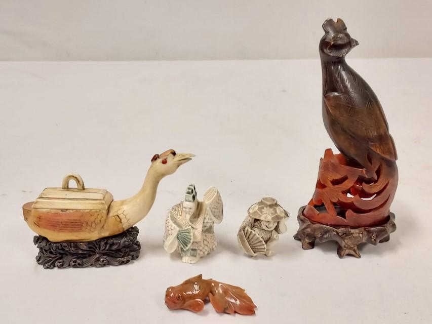 GROUP ASSORTED CHINESE & JAPANESE MINIATURES 5 PCS: Small group of assorted Chinese and Japanese miniatures. Includes a carved horn bird with stand, a carved bone crane box with stand, two small carvings of men, a small stone carved goldfish. Condition