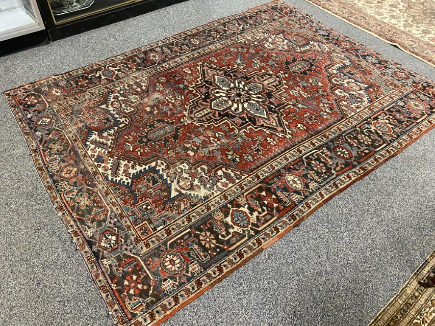 SEMI ANTIQUE PERSIAN HERIZ RUG 6' X 9': Semi antique Persian Heriz hand knotted carpet measuring 6'3" x 9'1". Condition: heavy wear to pile, fringes cut and damaged, wear and minor losses to selvedges, foundation showing though pile, see im