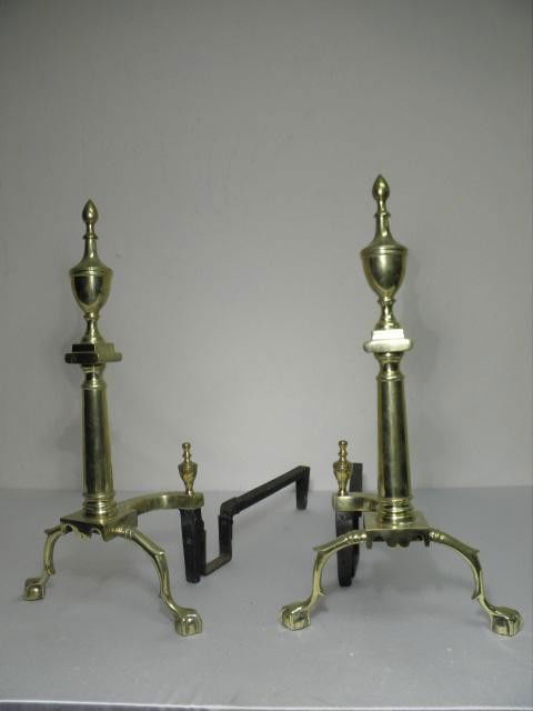 PAIR CHIPPENDALE STYLE BRASS BALL & CLAW ANDIRONS: Pair Chippendale style brass ball and claw andirons by Marvin Co.. Brass body with painted metal log rests. Condition: minor dings and dents, see images. Each measures 24" tall x 8.5" deep. Shipping w