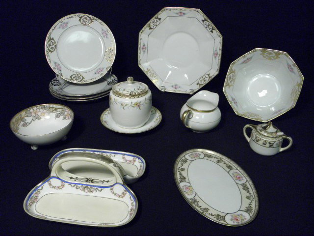 NIPPON FLORAL PORCELAIN DINNERWARE 13 PCS: Assorted Nippon porcelain floral dinnerware. Includes 13 pieces. Assorted and similar hand painted and gilt floral patterns. All pieces marked on base. Includes butter tray, covered sugar bowls, bowls
