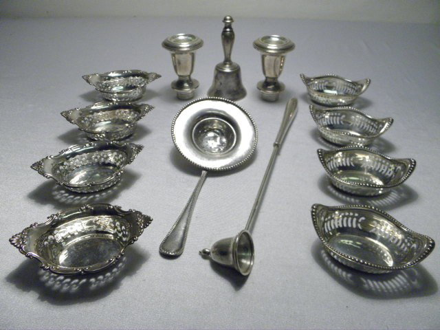 GROUP ASSORTED STERLING SILVER: 10.48+ TROY OZ: Group lot of assorted sterling silver. Includes eight Gorham reticulated nut bowls, tea strainer, a candle snuffer, a sterling bell (no clapper) and two weighted candlestick inserts (inserts only). Al