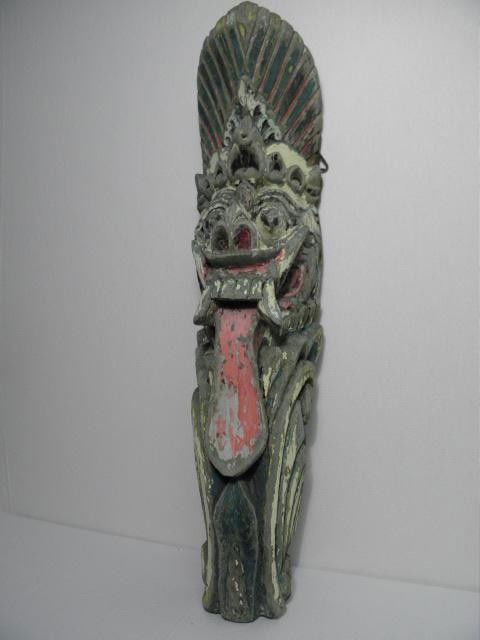 BALINESE SPIRITUAL TEMPLE WOOD CARVING: BALI: Polychrome Balinese spiritual temple wood carving. Marked/signed illegibly on top part of reverse. Hook for hanging. Condition: heavy signs of wear and age, loss to paint, minor losses, dents to wood,