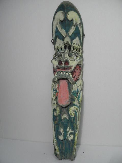 BALINESE SPIRITUAL TEMPLE WOOD CARVING: Polychrome Bali/ Balinese spiritual temple wood carving. Polychrome in colors of blue, yellow, pink, black, cream, etc. Hook for hanging and illegible writing on reverse. Measures 29" tall x 6.25" wid
