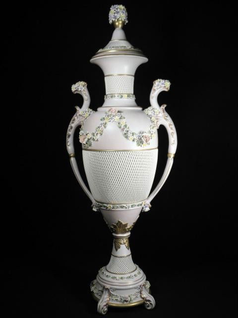 LARGE CAPODIMONTE PINK SPAGHETTI PORCELAIN VASE: Large Capodimonte "Spaghetti" style porcelain vase. Pink porcelain with multicolored applied flowers and bouquet finial to lid, side handles and gilt highlights. Ready to be electrified, with hardware