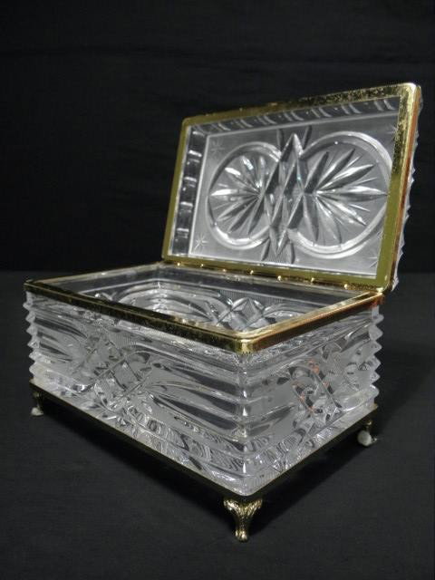 FROSTED & CUT CRYSTAL JEWELRY CASKET: Frosted and cut crystal jewelry casket. Gold-tone metal mounts. Footed. Condition: good, minor wear to metal and hinge, see images. Measures 7" wide x 4.5" tall. Shipping weight 4.6 lbs.
