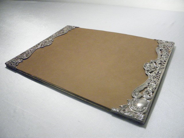VICTORIAN STERLING SILVER DESK BLOTTER: Gorham sterling silver desk blotter edges. Detailed chased and reticulated silverwork on sides. Faux alligator skin backing. Stamped "Sterling" with Gorham makers marks. Condition: wear from age, tarn