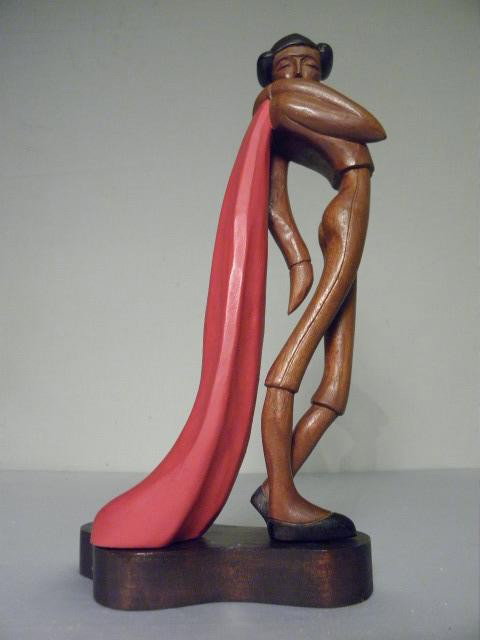 JOSE PINAL CARVED ART DECO STYLE MATADOR SCULPTURE: Jose Pinal (1913-1983) carved art deco style matador. Carved and painted wood on base marked "j Pinal" on reverse. Stamped "Made in Mexico" on base. Condition: good, see images. Measures 12" tall x 7.
