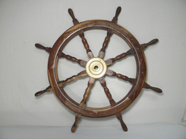 20TH C WALNUT & BRASS SHIPS WHEEL: 20th century walnut and brass ships wheel. Brass center with 8 spindles. Condition: good, see images. Measures 36" across. Shipping weight 16.5 lbs.