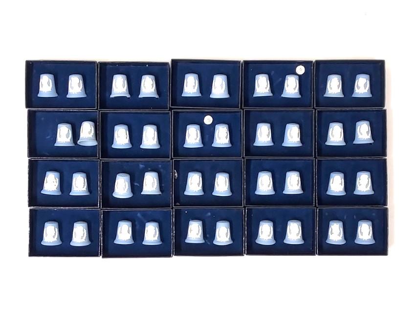 40 WEDGWOOD KING / QUEEN BLUE JASPER THIMBLES: Forty blue jasperware thimbles from 'The Kings & Queens of Legend' collection. Each is in very good condition without chips, cracks, or repairs. Sold together with 17 navy blue original boxes that fit