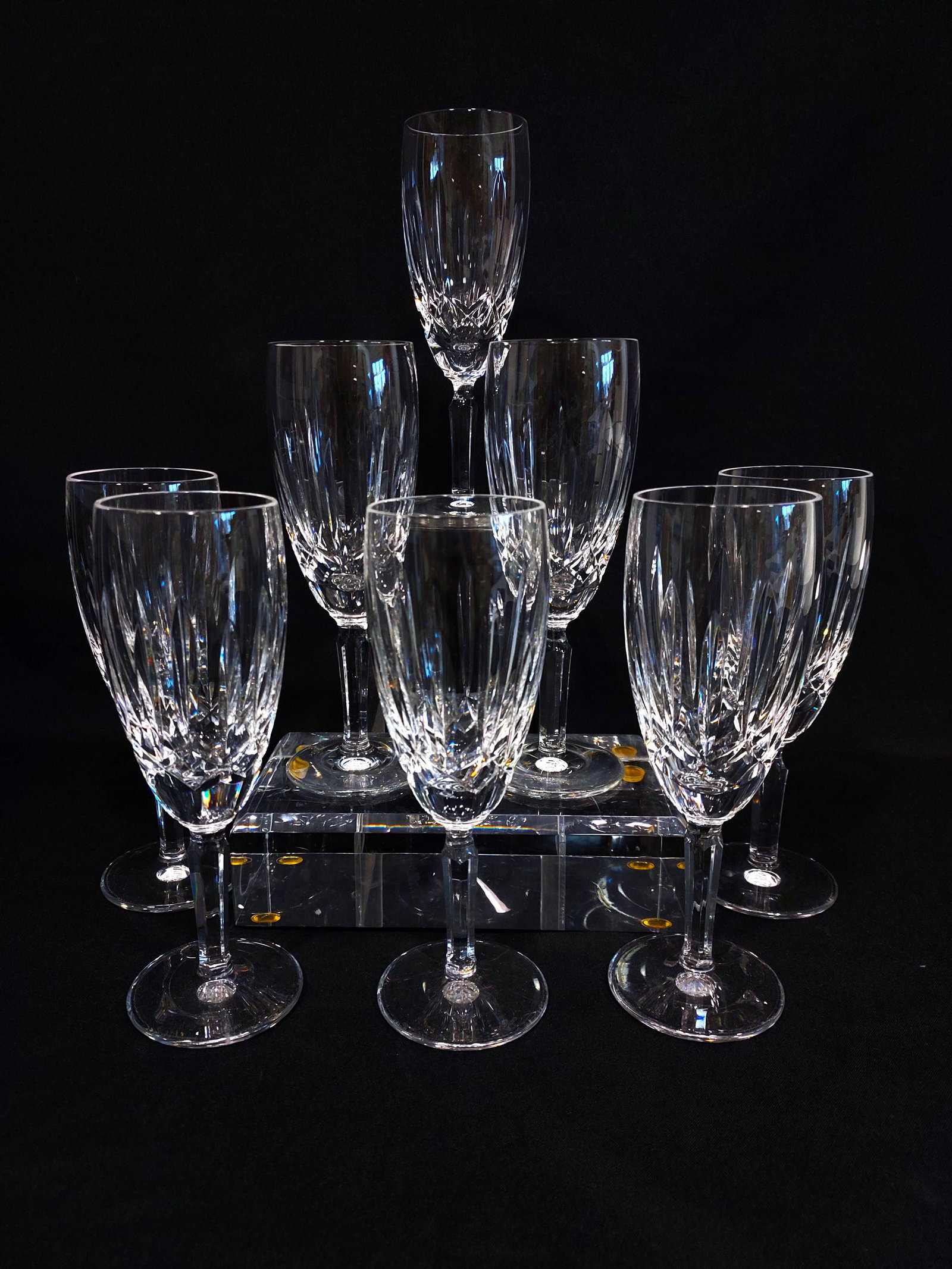 WATERFORD "KILDARE" CUT CRYSTAL CHAMPAGNE FLUTES: Set of eight Waterford Kildare pattern cut crystal champagne flutes. Each one measuring 7.4" tall and signed on base. Condition: good, see images. Weight: 5 lbs.