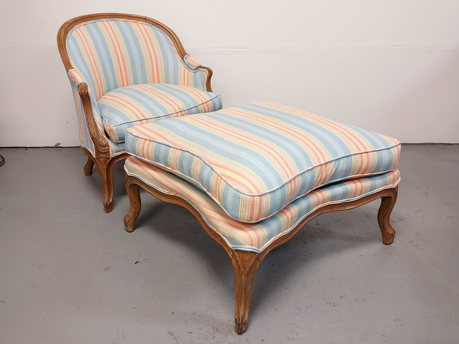 ANTIQUE LOUIS XV STYLE ARMCHAIR & OTTOMAN: Antique Louis XV style armchair and ottoman. Chair measures 31" tall x 30" wide and 27" deep. Ottoman measures 16" tall x 32" x 32". Newer fabric upholstery. Condition: mark to fabric on ottoman, norm