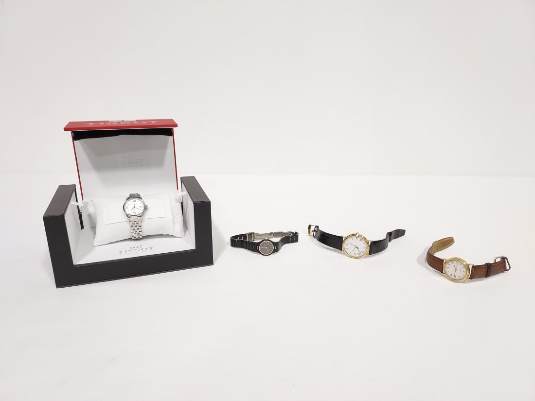 LADIES & UNISEX WATCHES: TIFFANY & CO, TISSOT, ETC: Lot of both ladies and unisex watches. Includes a unisex Tiffany & Co gold tone watch with leather band (not running) , a smaller Tiffany & Co ladies gold tone watch with leather band (not running), a