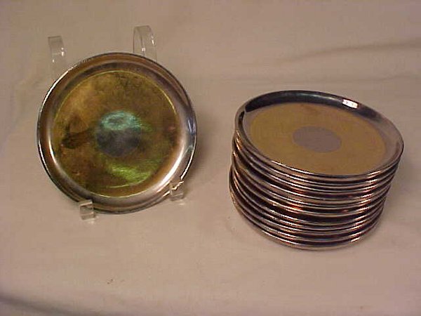 RUSSEL WRIGHT LUSTER POTTERY PLATES 8": RUSSEL WRIGHT LUSTER POTTERY PLATES 8" Ten gold and silver metallic pottery plates. Each measures 8" wide. Silvered rim, wide gold band, center silver circle over pink or white pottery bases. Reverse