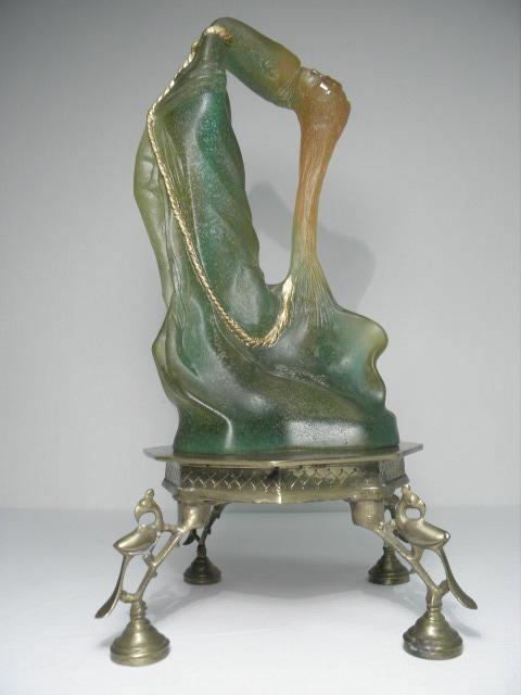 SALVADOR DALI DAUM CRYSTAL SCULPTURE: VENUS DE MIL: Salvador Dali Daum Crystal sculpture titled, "Venus de Milo Hysterique." Daum Crystal 1983, Pate de Verre in clear, green, orange, and yellow. Partial gold painting, and partially polished. Signed "Da