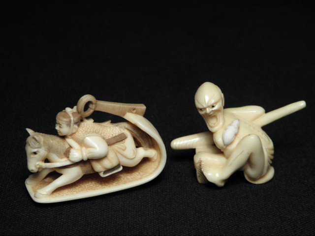 TWO JAPANESE CARVED IVORY NETSUKE: Two Japanese carved ivory netsuke. Includes a display depicting a man riding a horse, and a man with an angry expression, and a mouse on his back. Both are signed on base. Condition: no signs of damag