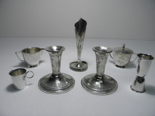 GROUP LOT ASSORTED STERLING SILVER: 7 PCS 16.59+ T: Group lot of assorted sterling silver. Includes a Mexican Sterling footed tall bud vase, a creamer and lidded sugar combo, candle snuffer, miniature handled cup, egg cup, and a pair of Sterling weight