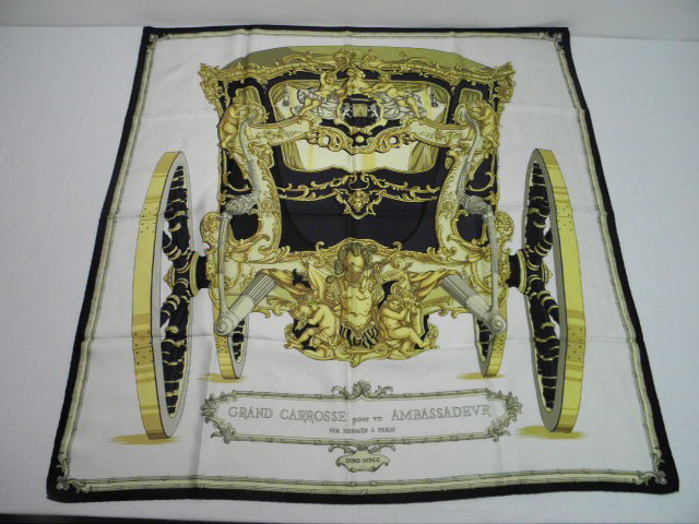 VINTAGE HERMES SILK SCARF: Vintage Hermes silk scarf, "Grand Carrosse pour un Ambassadeur", in black and white on an off-white ground. Hand-sewn rolled edge, no care tag. Condition very good with no stains or damage. Measures a