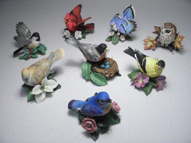 EIGHT LENOX COLLECTABLE PORCELAIN BIRDS: Eight Lenox collectable porcelain bird figurines. Includes "Saw Whet Owl", "Cardinal", "Eastern Bluebird", "Turtle Dove", "Chickadee", "American Goldfinch", "American Robin", and "Blue Jay". All piece