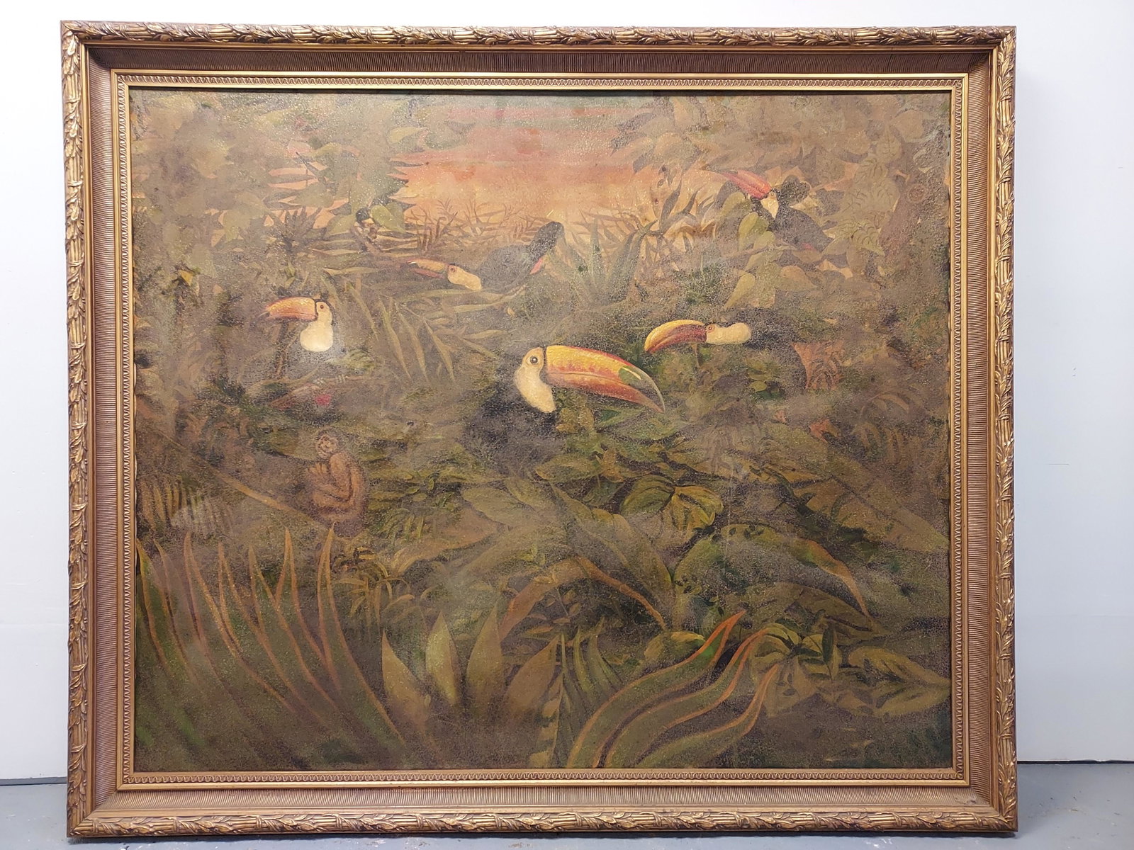 MONUMENTAL OIL ON CANVAS PAINTING: JUNGLE SCENE: Monumental oil on canvas decorative painting depicting a jungle scene with toucans and monkeys. Does not appears to be signed. Measures (frame) 69" tall x 81" wide and 3.25" deep. Condition: heavy sun