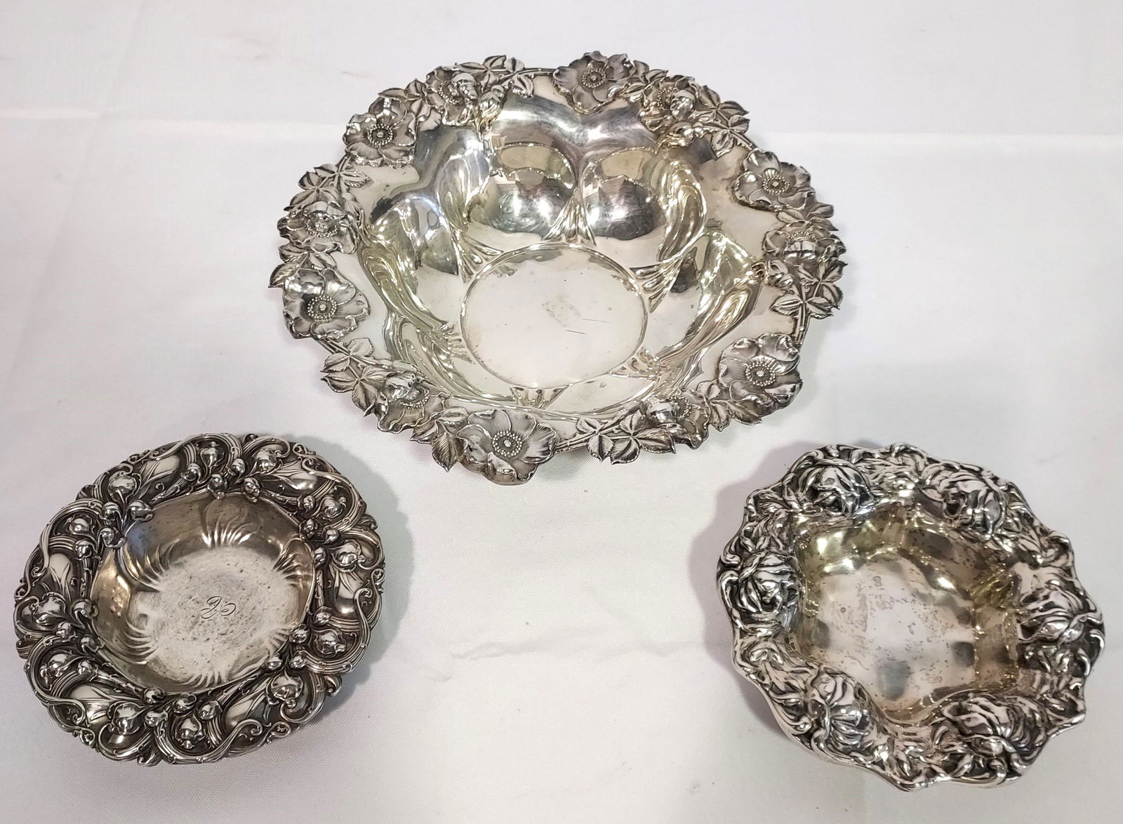THREE STERLING SILVER CHASED FLORAL BOWLS (1 of 20)
