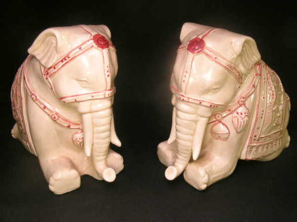 PR DECORATIVE CERAMIC INDIAN ELEPHANT FIGURES: Lot 1050: PR DECORATIVE CERAMIC INDIAN ELEPHANT FIGURES - Measures 7" high x 8" deep x 4" wide. No chips, cracks or crazing. Stamped Nancy Lopez 1980