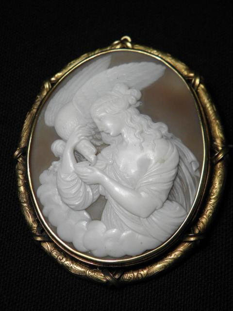 LARGE 19TH C CARVED SHELL CAMEO 14KT GOLD BEZEL: A large well carved shell cameo brooch / pendant with ornate engraved 14kt yellow gold bezel. Original glass backing intact. Total weight 27.2 dwt. Measures 3" tall x 2 1/4" wide. Condition good witho