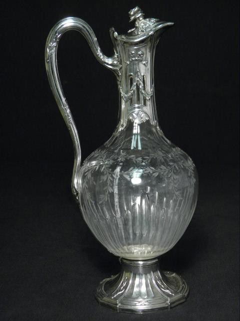 CHRISTOFLE CRYSTAL & STERLING SILVER MOUNTED EWER: Christofle crystal and sterling silver mounted ewer. Hallmarked on lid, arm, neck, and base. Most legible hallmark is on the neck, and is the "Christofle Solid Silverware" mark. Sterling silver is eng