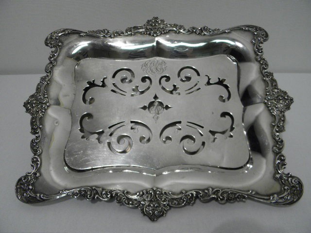 BLACK, STARR & FROST STERLING SILVER TRAY WITH INS: Black, Starr & Frost sterling silver serving tray with insert. Ornamental floral swag border, and with a matching pierced metal four footed insert. Both the tray (under insert) and insert are monogram