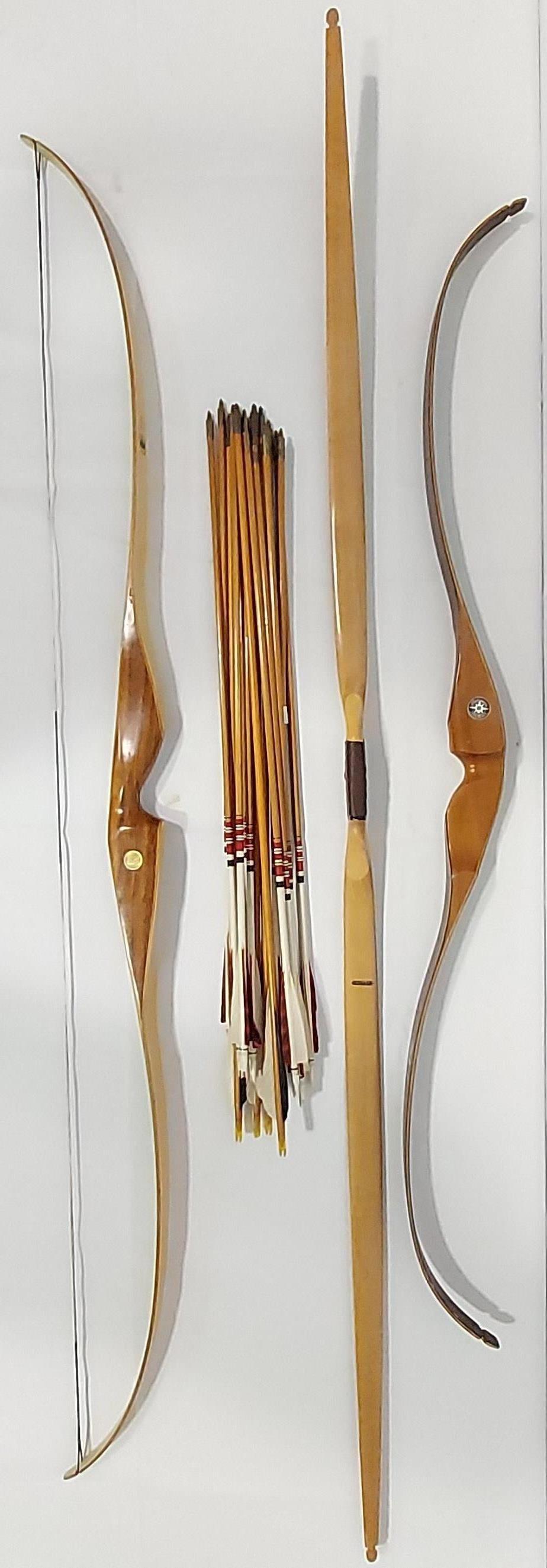 THREE VINTAGE WOODEN ARCHERY BOWS AND ARROWS: Lot of three vintage wooden bows and arrows. Includes a Bear Archery Glass Powered Cub 62" 36#, a Shakespeare Archery The Sierra Model X18 52" 40# (no string), and a Ben Pearson 501-30 67" unstrung bo