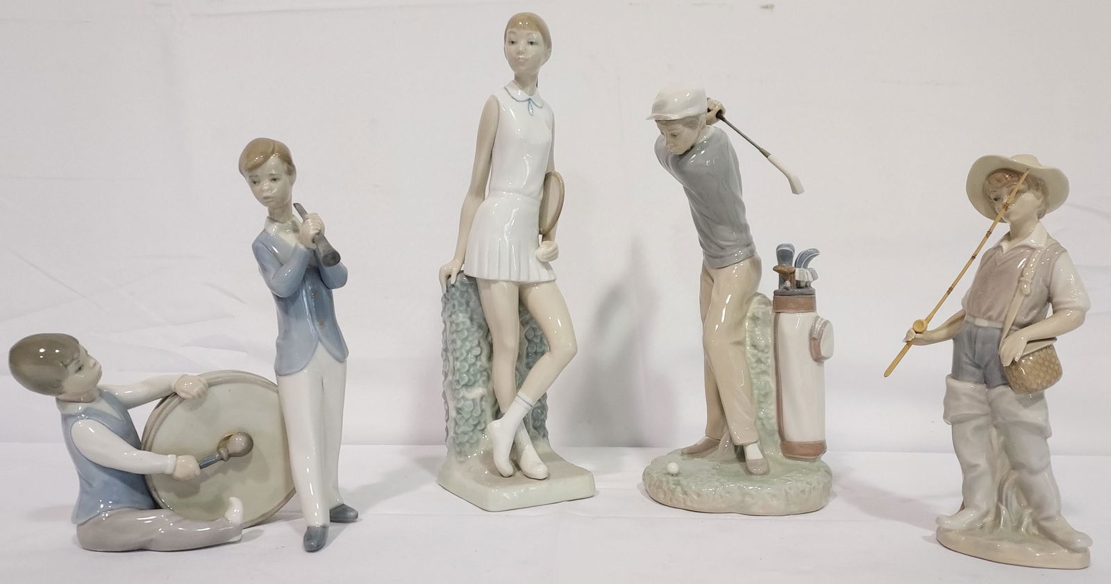 FOUR LLADRO PORCELAIN FIGURINES: TENNIS, GOLF, ETC (1 of 13)
