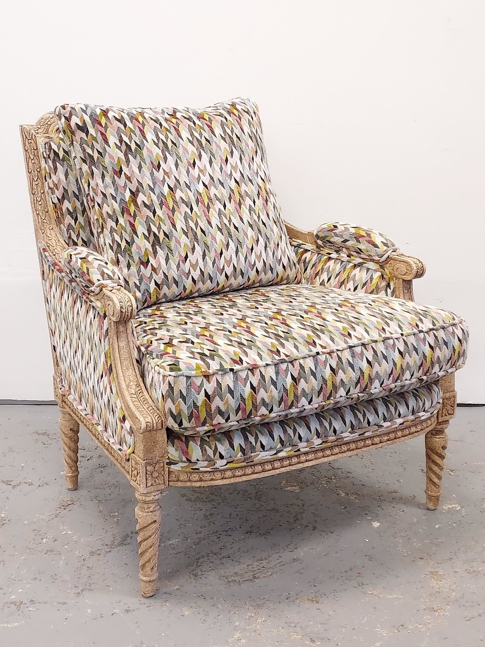 VINTAGE LOUIS XVI STYLE BERGERE ARMCHAIR: Vintage Louis XVI style French bergere armchair measuring 35.25" tall x 32" wide and approx. 34" deep. Custom re upholstery covering any maker's labels. Condition: good, a few tiny blemishes to frame,