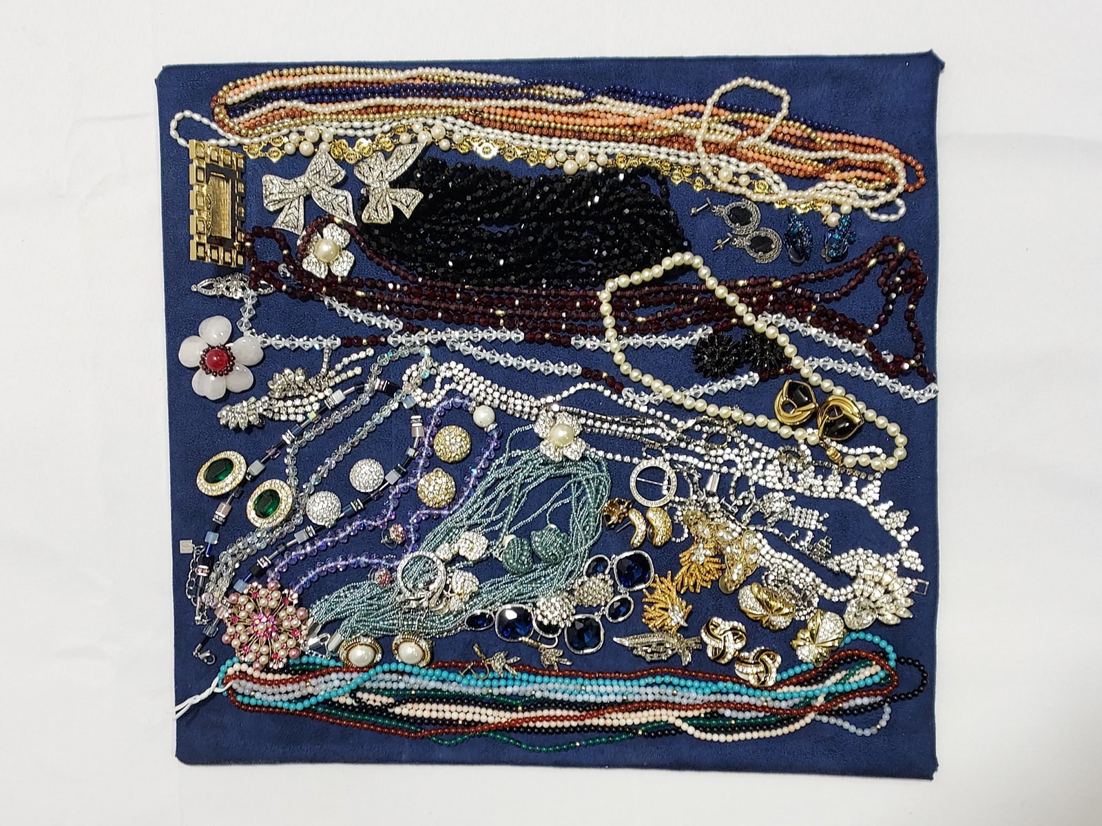 TRAY LOT ASSRT LADIES COSTUME JEWELRY: RHINESTONES: Tray lot assorted ladies costume jewelry. Includes a wide variety of styles and brands, some include St. John, Swarovski, Kylo, Hobe, and more. Some of the materials are: 14k gold, pearls, vermeil, gl