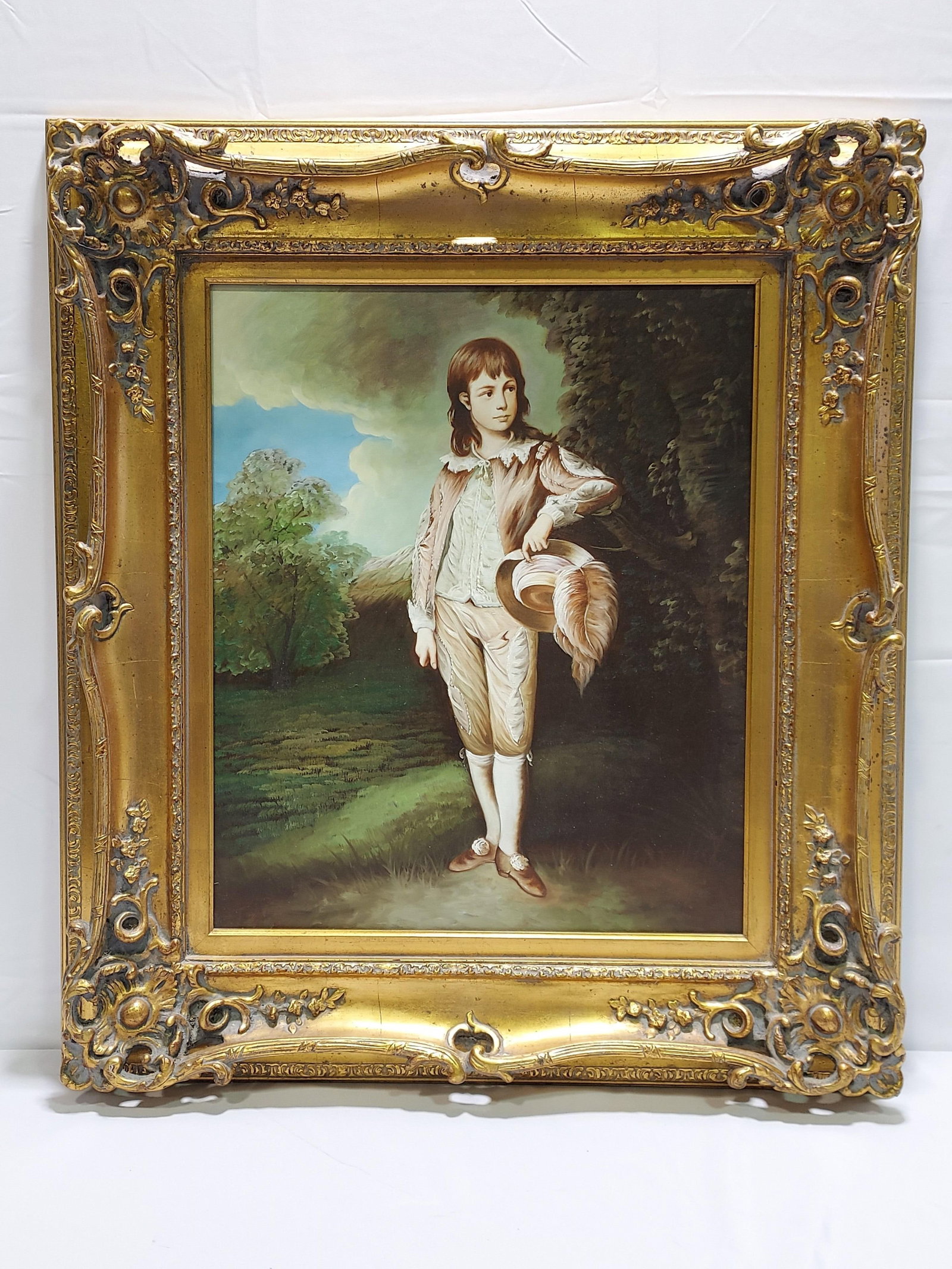 OIL ON CANVAS PAINTING AFTER THOMAS GAINESBOROUGH: Oil on canvas painting after Sir Thomas Gainesborough's "Pink Boy". Measures (frame) 34.5" tall x 30.5" x 3.5" deep, and (sight) 23" tall x 19" wide. Condition: a few small particle spots to canvas, f