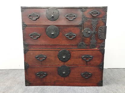 ANTIQUE JAPANESE MEIJI ERA TWO PIECE TANSU CHEST: Antique Japanese two piece Tansu chest. Measures a total of 38" tall x 39" wide and 17.5" deep. Painted bronze mounts throughout. Includes original bill of sale. Condition: scattered nicks and