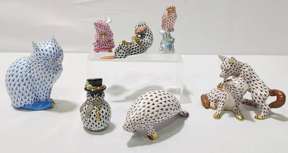 SEVEN HEREND FISHNET PORCELAIN FIGURES CAT FOX MOU: Herend fine porcelain figurines. Seven pieces consisting of: A blue sitting cat 4.5" x 4" x 2", brown double fox figurine 3.25" x 3.25" x 5". a brown manatee 5.5" x 2.5" x 2", black otter 2" x 4" x 1.