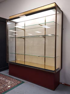 PAUL DUPRE-LAFON FOR HERMES: DECO VITRINE, C. 1935: Paul Dupre-Lafon for Hermes, art deco vitrine, circa 1935. Brass, leather and glass. Lighted from the top. Measures a total of 81" tall x 70.5" wide and 19" deep. Opens at both sides and includes