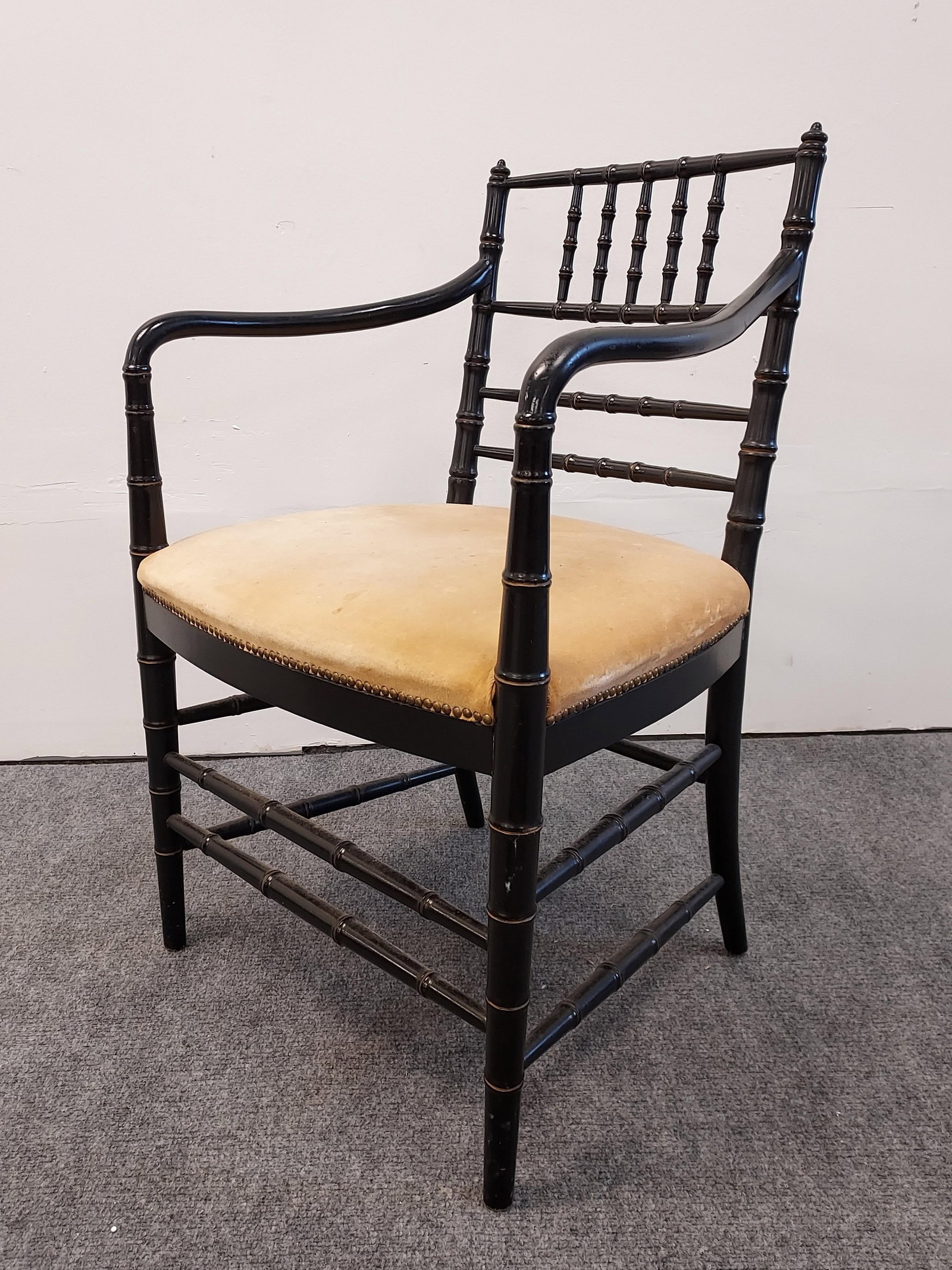 VINTAGE BLACK CARVED WOOD BAMBOO STYLE ARMCHAIR: Vintage black carved wood bamboo style armchair measuring 33" tall x 21.5" wide and 21" deep. Condition: soiling / spots to upholstered seat, otherwise good but for minor nicks and wear to finish, see