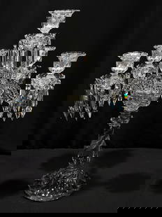 BACCARAT CRYSTAL FOUR ARM CANDELABRUM: Baccarat crystal four arm candelabrum. Missing two arms, leaving a total of four. Disassembles at joints for storage or transportation. Signed on base "Baccarat Depose". Measuring 24.6" tall x 15.75"