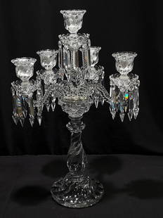 BACCARAT CRYSTAL FOUR ARM CANDELABRUM: Baccarat crystal four arm candelabrum. Missing two arms, leaving a total of four. Disassembles at joints for storage or transportation. Signed on base "Baccarat Depose". Measuring 24.6" tall x 15.75"