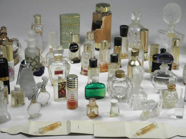 GROUP MINIATURE CRYSTAL & GLASS PERFUME BOTTLES: Group lot of assorted miniature crystal and glass perfume bottles. Includes bottles by Chanel, Faberge, Givenchy, Prince Matchabelli, Ariane, and many more French makers. Some tops and stoppers may be