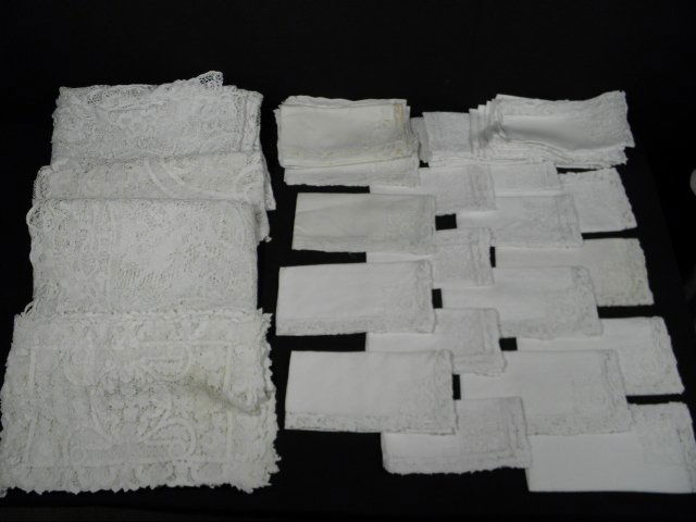 ESTATE LINEN GROUP: LACE, CUTWORK ETC: Lot of assorted tablecloths, napkins, placemats, and table runners. Includes (10) 17" x 12" placemats, (1) 9'5" x 4'8" floral lace tablecloth, (1) 4'4" x 1'5" lace table runner, (1) 8'4" x 4'11" figur