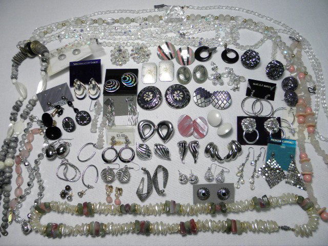 ASSORTED COSTUME JEWELRY: SILVER TONE MONET STERLI: Tray lot of costume jewelry: Approx. 40 pairs of earrings. One pair Sterling silver. 7 necklaces and 4 bracelets. Good condition. Weight approx. 2 lbs