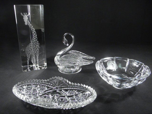 FOUR PIECES ASSORTED CRYSTAL: ORREFORS, KOSTA, ETC: Lot of four pieces of assorted crystal and glass. Includes a 9" Kosta "Lindstrand" crystal prism with etched Giraffe, a 6" wide Orrefors cut crystal bowl, an Edinburgh blown glass swan, and a small 8.