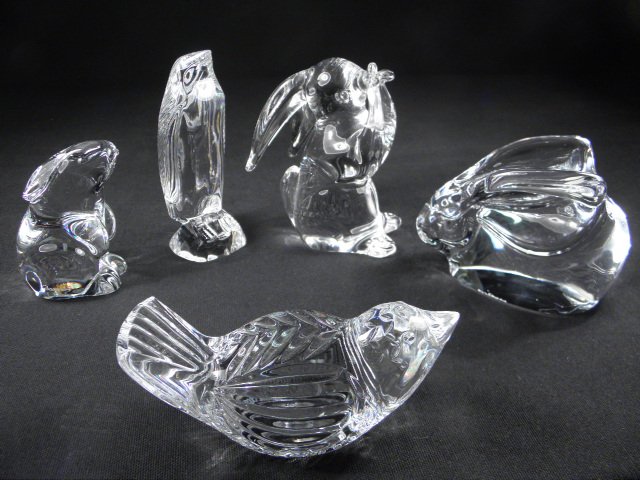 FIVE CRYSTAL ANIMAL FIGURINES: BACCARAT, WATERFORD: Five crystal animal figurines. Includes a Baccarat rabbit sitting on hind legs, a Waterford sitting bird, a Waterford penguin, an Orrefors sitting rabbit, and an unmarked figurine of a rabbit eating. 