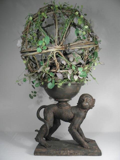 DECORATIVE RESIN MONKEY PLANTER: Decorative resin monkey sculpture planter. Vine ball above monkey can be opened for plants. Marked on paper label on base "Natural Decorations Inc.". Condition: good, see images. Measures 34" tall x 1
