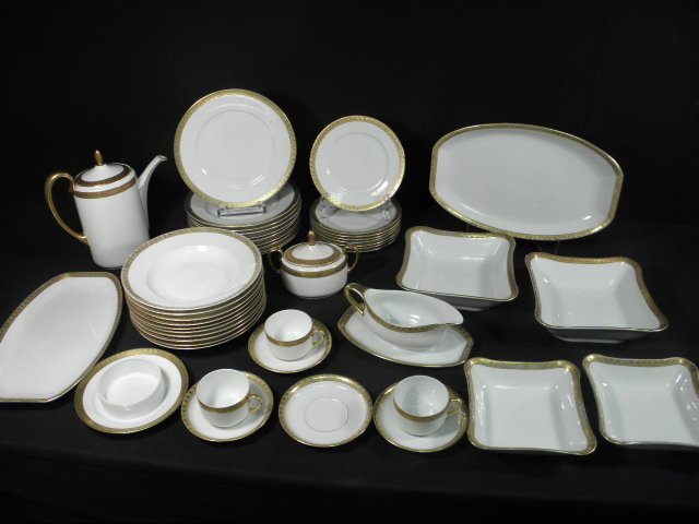 EDELSTEIN BAVARIAN GOLD-BANDED DINNERWARE: 45 PCS: Lot of assorted Edelstein Bavarian porcelain dinnerware with a gold banded pattern. Includes 45 total pieces: (10) 9.75" plates (one with chip), (10) 9.75" soup bowls, (8) 8" plates, (4) 5.5" saucers 