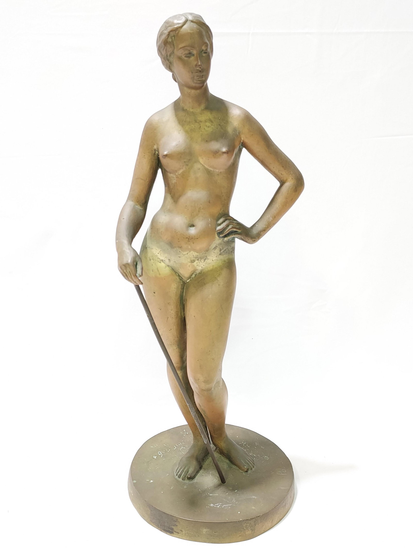 ART DECO BRONZE SCULPTURE OF A NUDE WOMAN: Art Deco bronze sculpture of a nude woman measuring 21.25" tall x 8" base diameter. Signed on the base with what appears to read "Pomah". Also marked on the edge of base with an unknown foundry mark a
