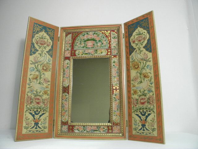 JOHN WIDDICOMB REVERSE PAINTED FOLDING VANITY MIRRO: John Widdicomb reverse painted folding vanity mirror. Overall antiqued finish, with a wall cabinet design, and two doors opening up to reveal a mirror with colorful reverse painted glass friezes and g